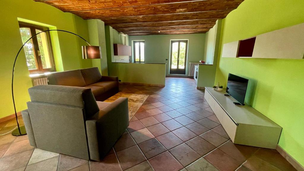 a living room with a couch and a fireplace at Sosta dei Passeggeri in Roccabruna