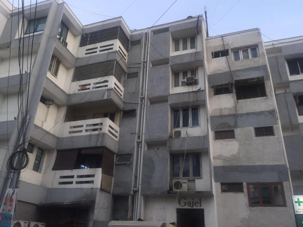 an apartment building with the words cabal on it at Convastay Gajel- Near Apollo Greams Road in Chennai