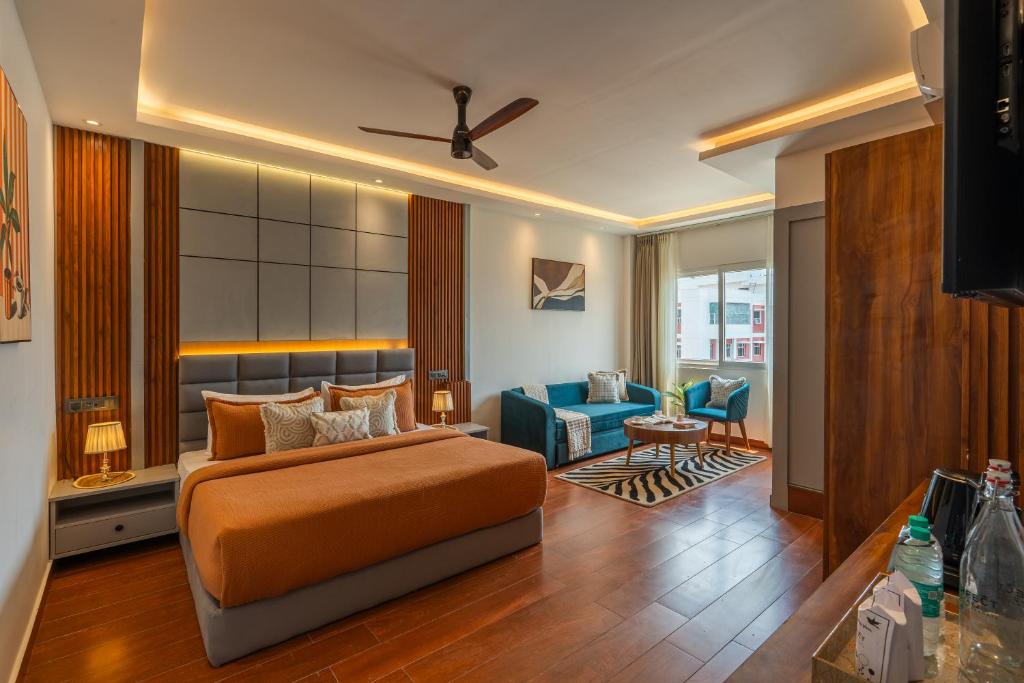 a bedroom with a bed and a living room at Perfectstayz AIIMS near Aiims Hospital in Rishīkesh