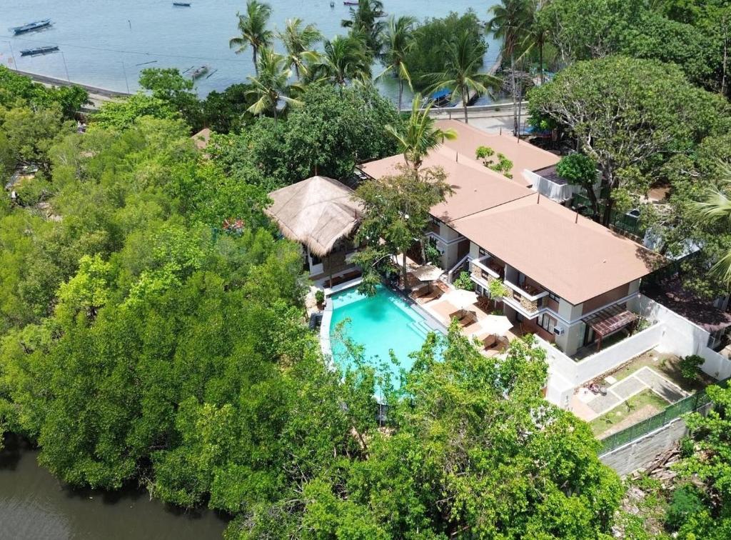 an aerial view of a house with a swimming pool at Katunggan Cove Resort in Nueva Valencia