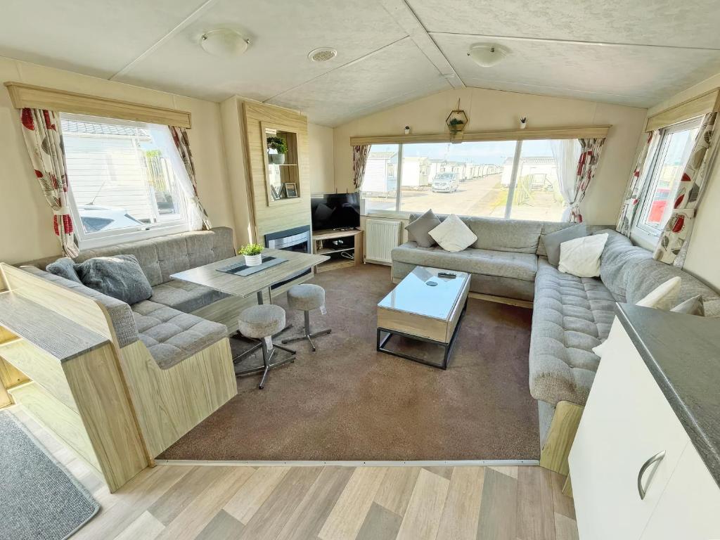 an rv living room with a couch and a table at Europa Caernarfon - Ukc9633 in Rowen