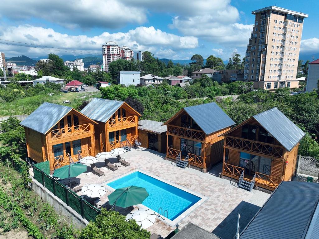 an overhead view of a house with a swimming pool at Seaside Cottages, BEDO HOUSE in Batumi