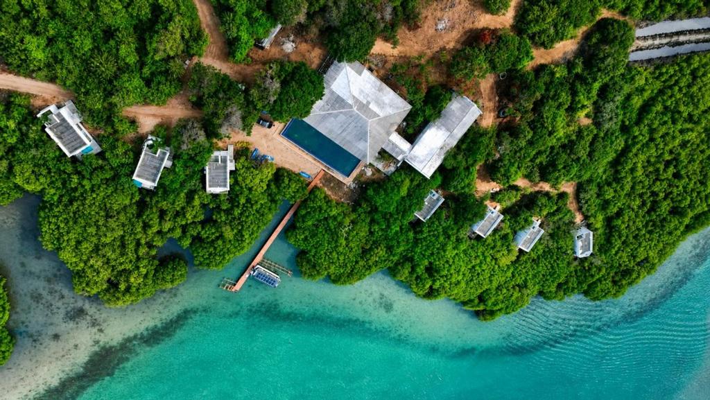 an aerial view of a house next to the water at Dutch Bay Resort & Spa in Kalpitiya