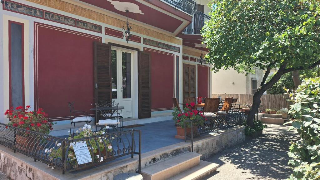 a porch of a house with a table and chairs at B&B De Angelis in Ginosa Marina