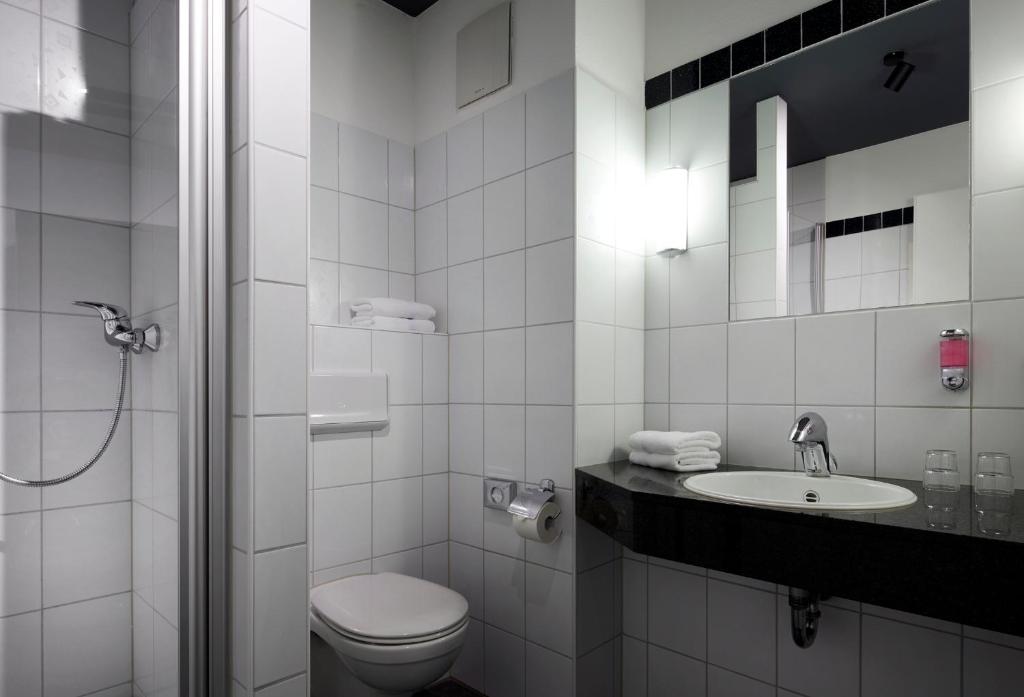 Koupelna v ubytování Dom Hotel