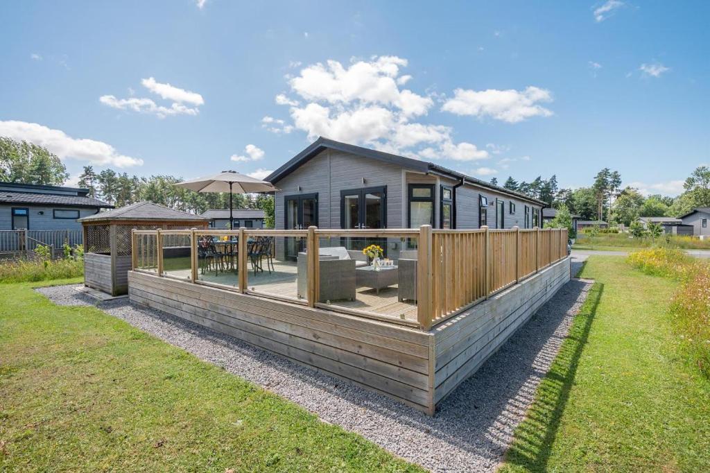a house with a deck and a fence at 3 Bed in York oc-90401 in Riccall