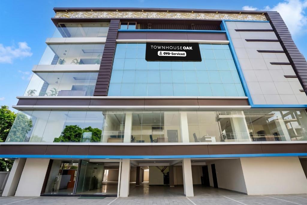 a building with a sign on the side of it at Super Townhouse Oak ISBT Bus Terminal Dehradun Formerly Hotel Himalayan in Dehradun