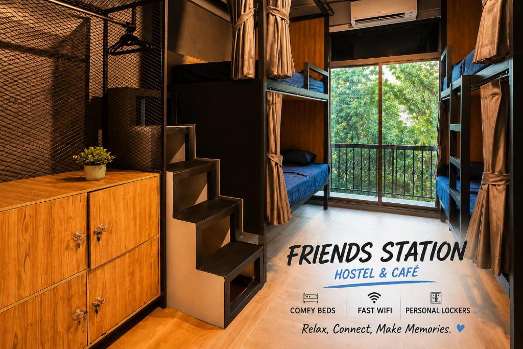a room with a bunk bed and a staircase at Hostel Friends Station & Cafe in Pattaya South