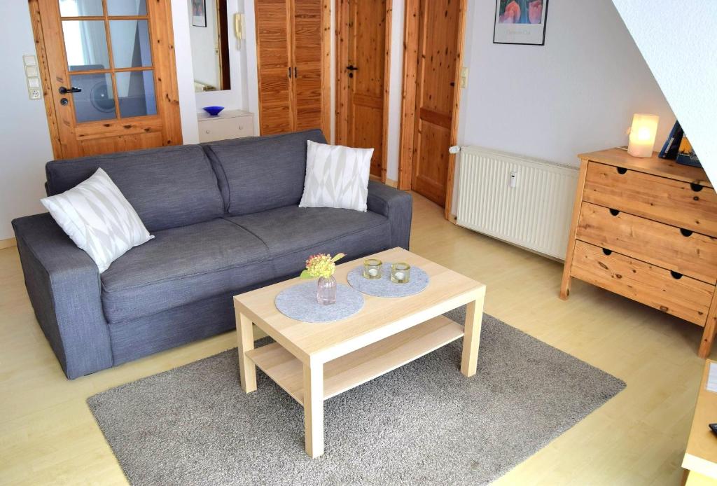 a living room with a couch and a coffee table at Zaumseil, Axel Fe-App "oben" in Schönberg