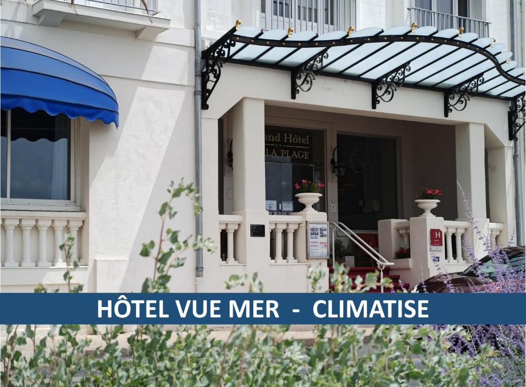 a white house with a sign that reads hotel were mer climate at CERISE Royan - Le Grand Hôtel de la Plage in Royan