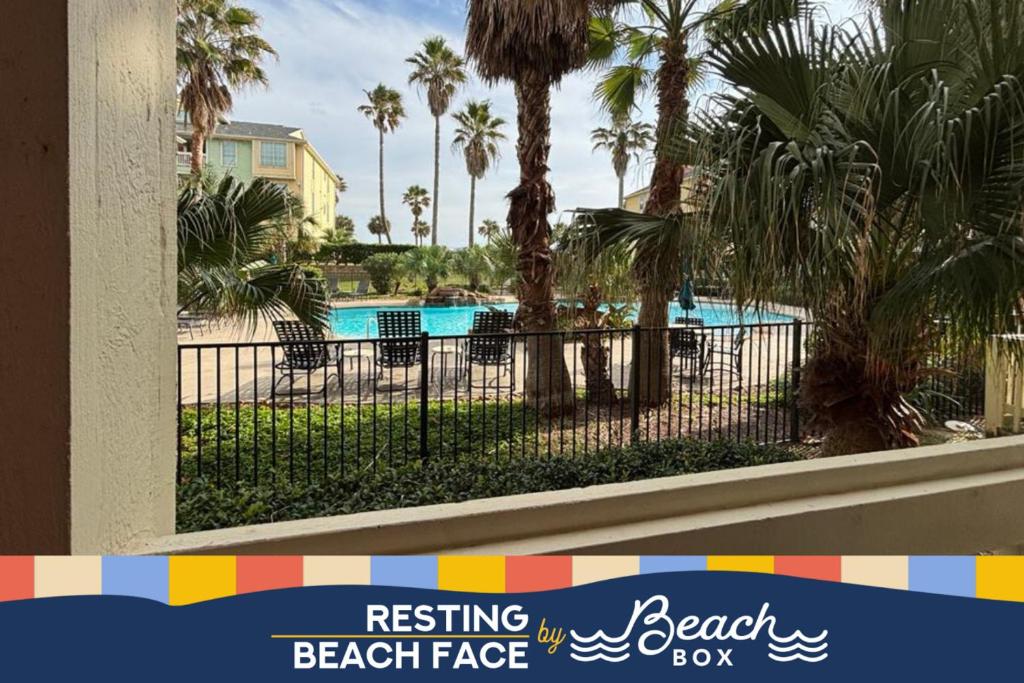 a view of the pool at the beach face resort at Modern condo right across from beach and pool in Galveston