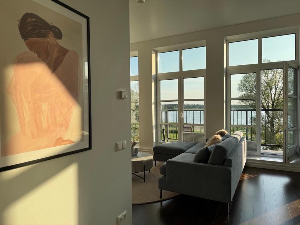 a living room with a couch with a dog laying on it at Tamula Panorama in Võru