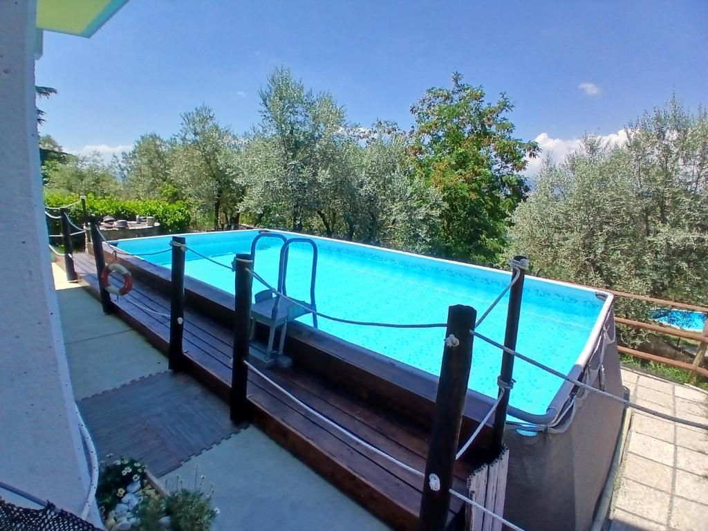 a swimming pool on the deck of a house at House Tramonto D'oro in Ficulle