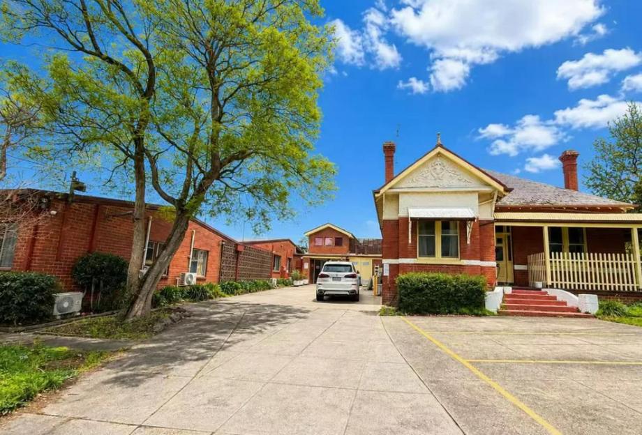 a truck parked in front of a house at Box Hill Student Accommodation and Rooming House in Box Hill
