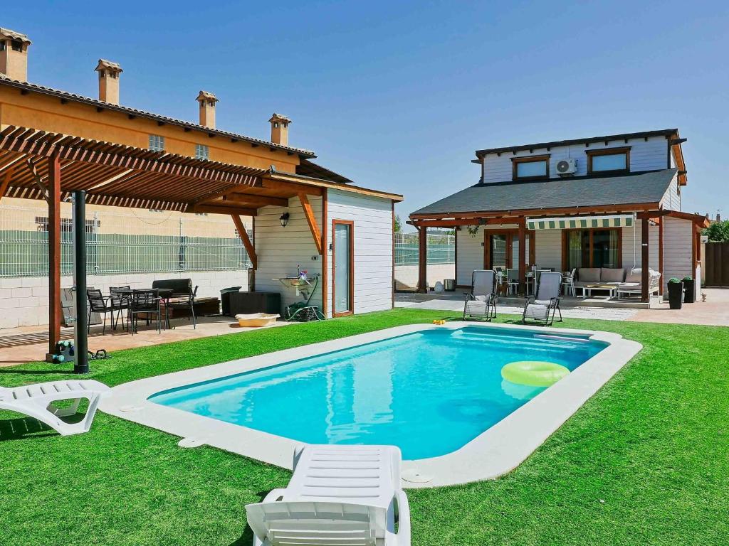 a swimming pool in the yard of a house at Luxury Rural Cuenca - Villas in Cuenca