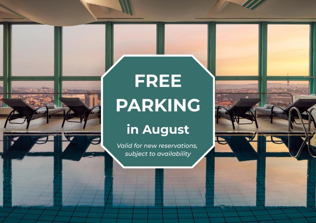 a sign that reads free parking in a hotel with a pool at Panorama by Verdi Hotels in Prague