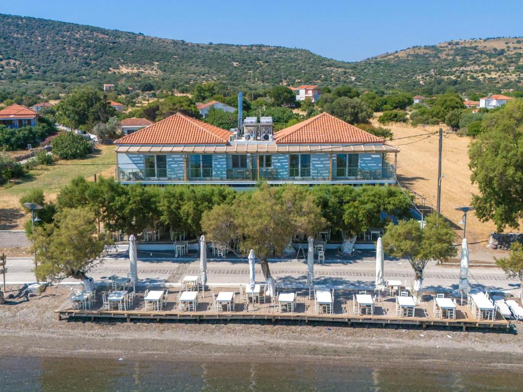 a resort with a lot of chairs and a building at Nyfida's four waves in Nifida