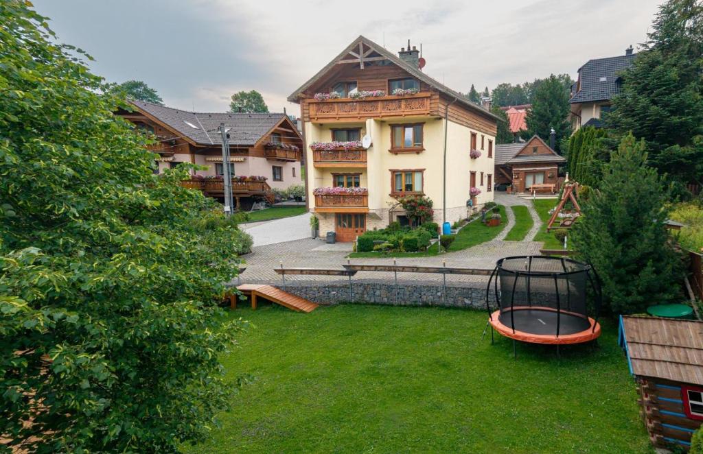 an aerial view of a large house in a yard at Privát Domino in Ždiar
