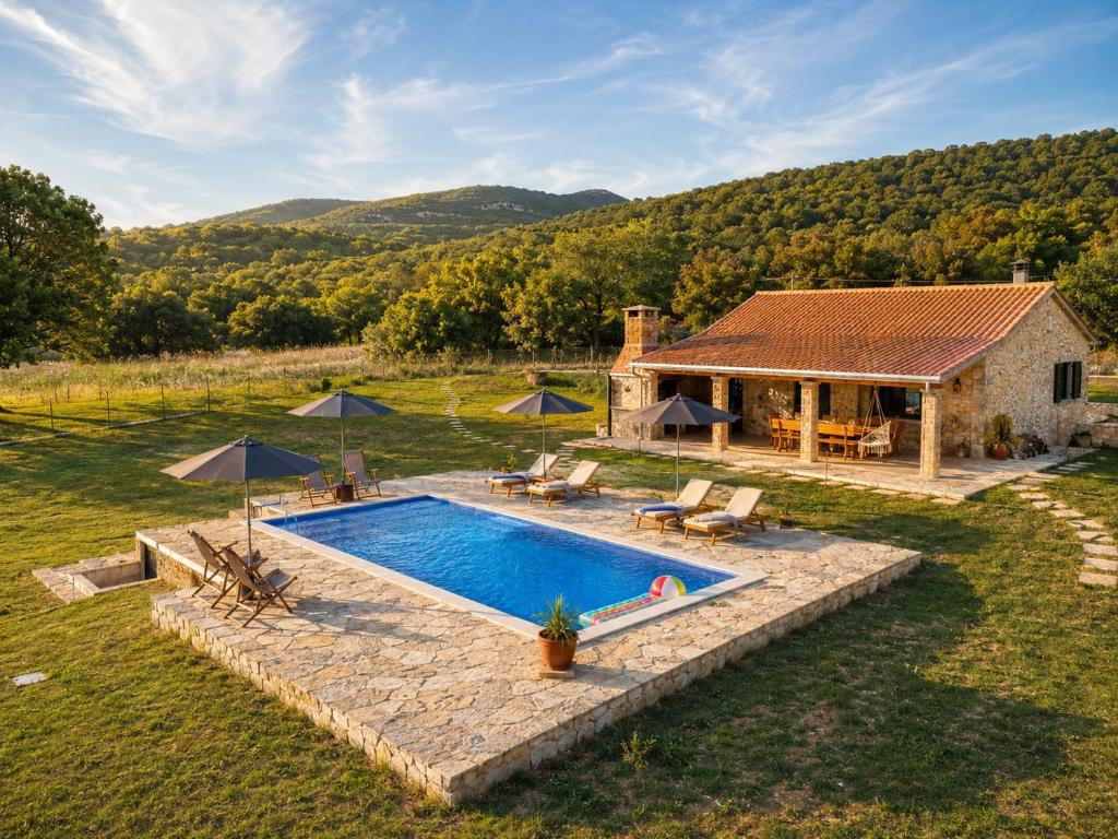 an aerial view of a house with a swimming pool at Villa MaLea in Neum