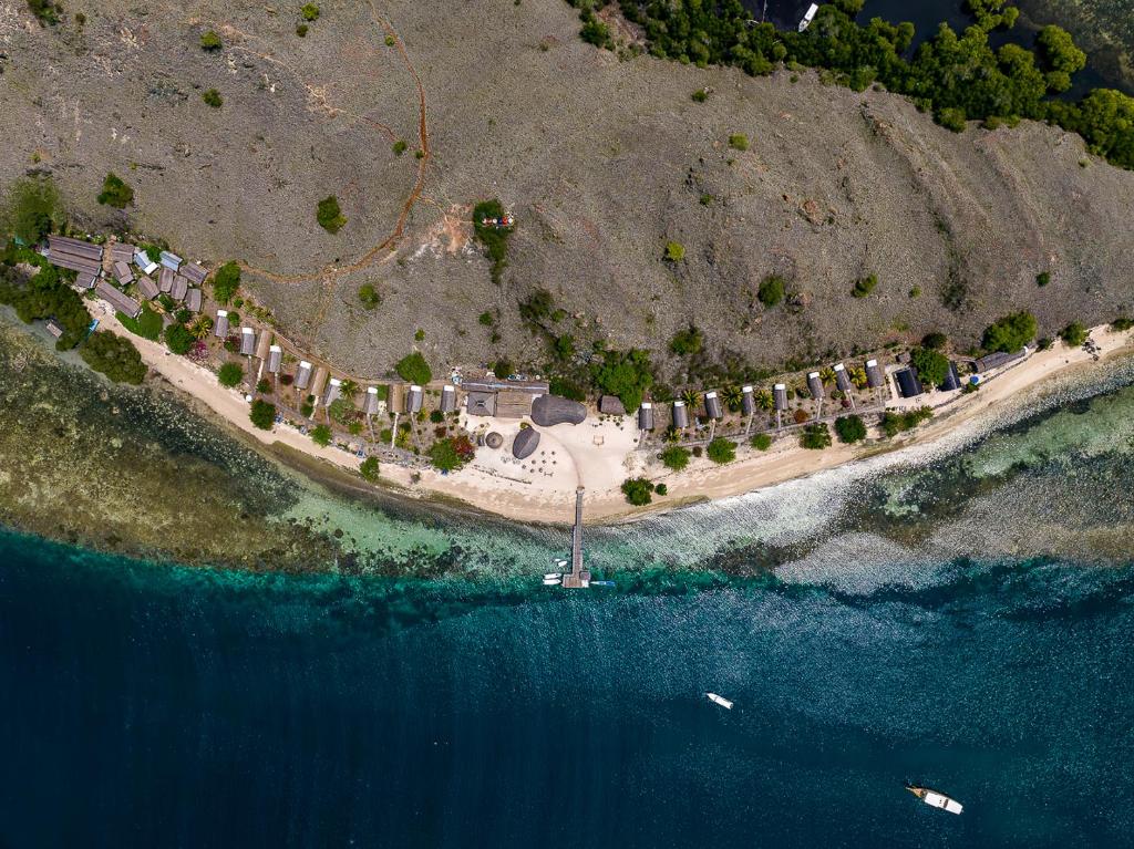 an aerial view of an island in the ocean at Komodo Resort in Sebayur