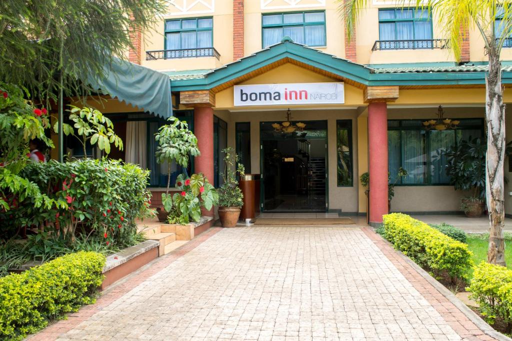 un bâtiment avec un panneau indiquant une auberge de bon air dans l'établissement Boma Inn Nairobi, à Nairobi