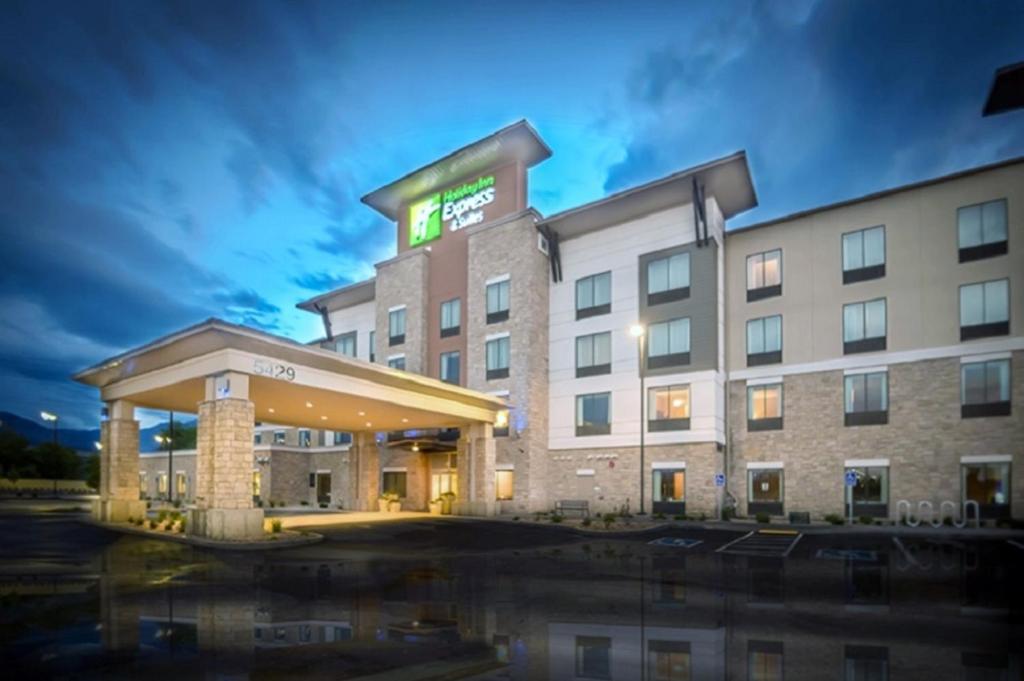 a rendering of a hotel building at night at Holiday Inn Express & Suites Salt Lake City South-Murray by IHG in Murray