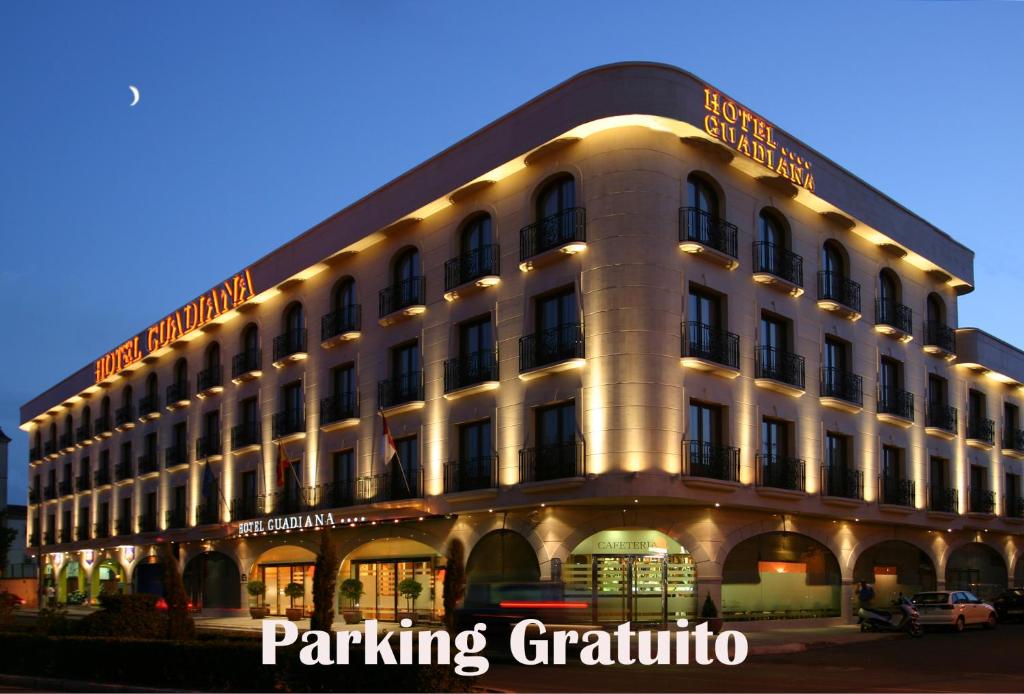 a large white building with lights on it at Sercotel Guadiana in Ciudad Real