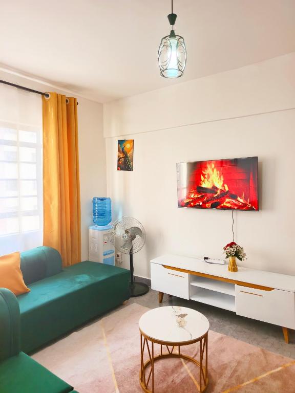 a living room with a couch and a table at 1&2&3bedroom KlenCBDMilimani apartments in Kisumu