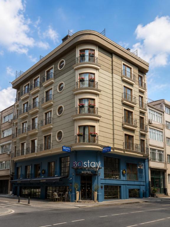 a large building on the corner of a street at BoStay Hotel in Istanbul
