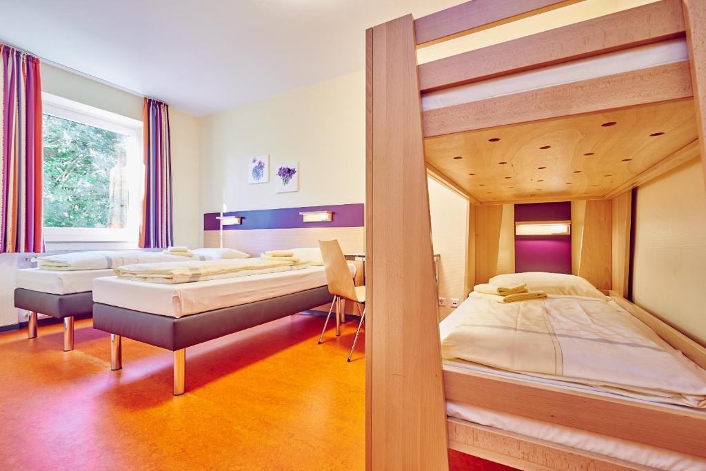 Säng eller sängar i ett rum på DJH Jugendherberge Hagen