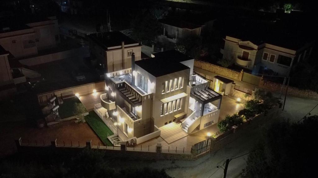 an aerial view of a house at night with lights at Villa Velvet Chios in Chios