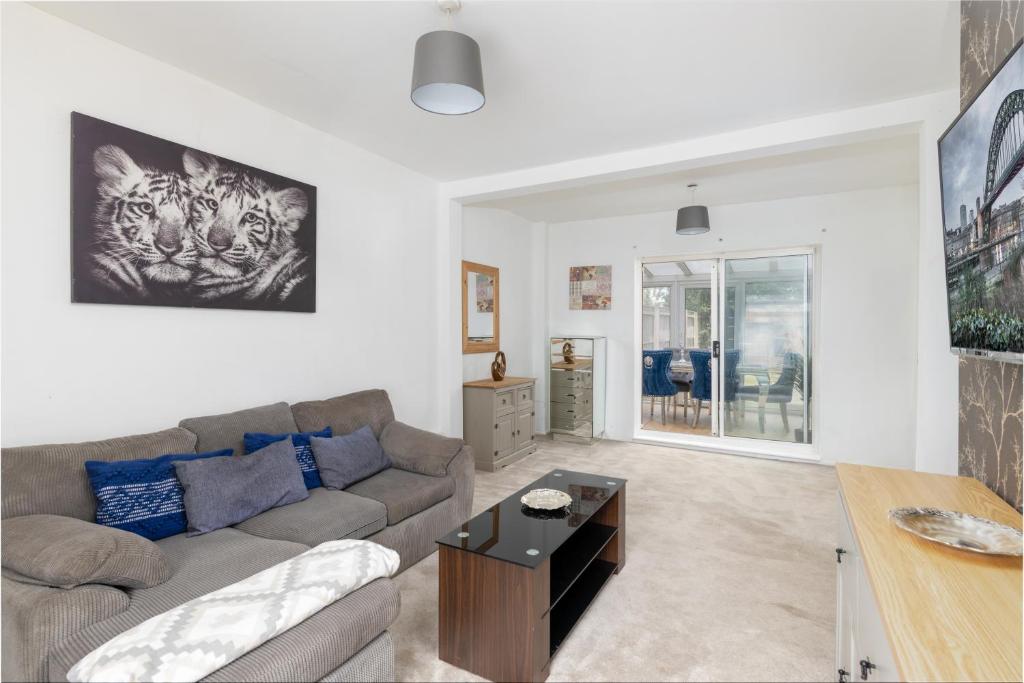 a living room with a couch and a table at Billingham Rooms in Stockton-on-Tees