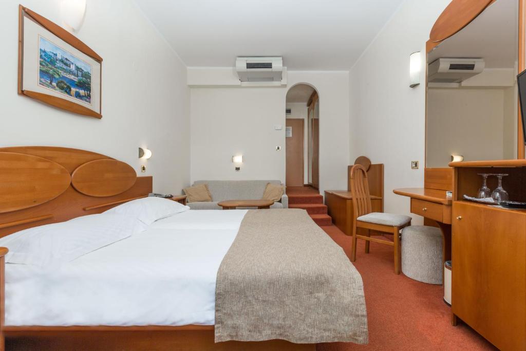 Łóżko lub łóżka w pokoju w obiekcie Villa Galijot Plava Laguna