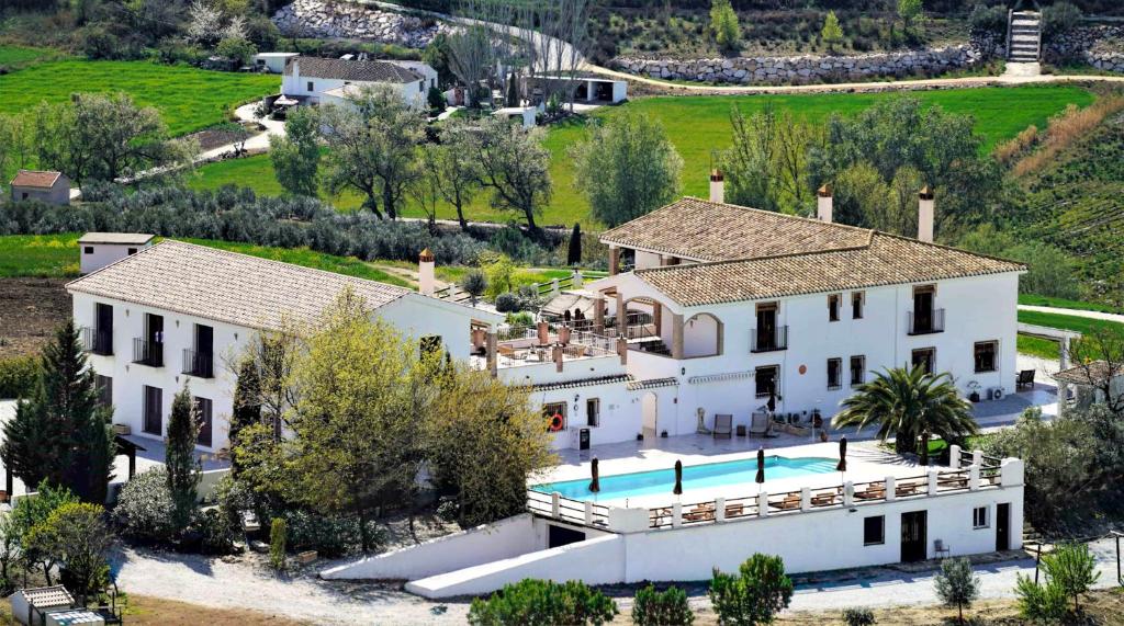 an aerial view of a house with a swimming pool at Lemon Tree Retreat at El Amparo in Alhama de Granada
