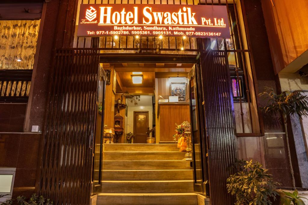 a building with a sign that reads hotel swissushka grill at Hotel Swastik in Kathmandu