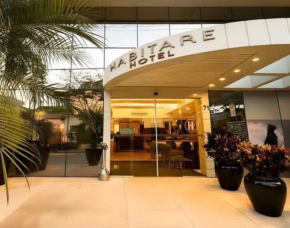 a store front of a building with a sign on it at Hotel Habitare in Nova Friburgo
