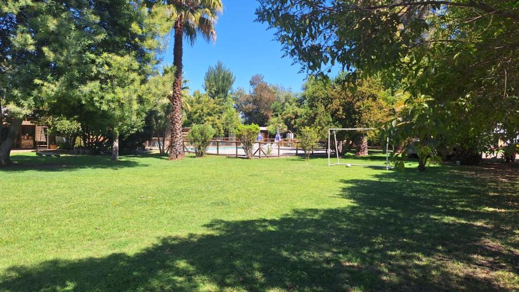 a park with a soccer field with a goal at Alojamiento Parcela El Aromo in Paine