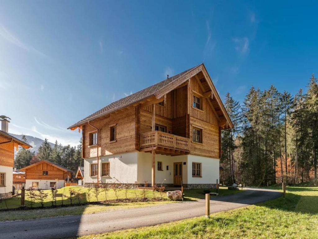 a large wooden house with a gambrel roof at Chalet Jona in Sonnberg