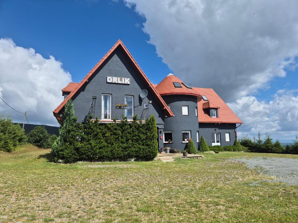 a house with a sign that reads prairie at ORLIK House in Duszniki Zdrój