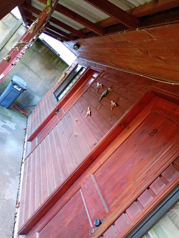 an overhead view of a large wooden garage door at Hostal y Cabañas Guaje in Valdivia