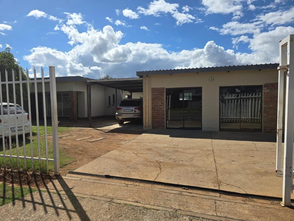 a house with a car parked in front of it at Cooperville 1 in Potchefstroom