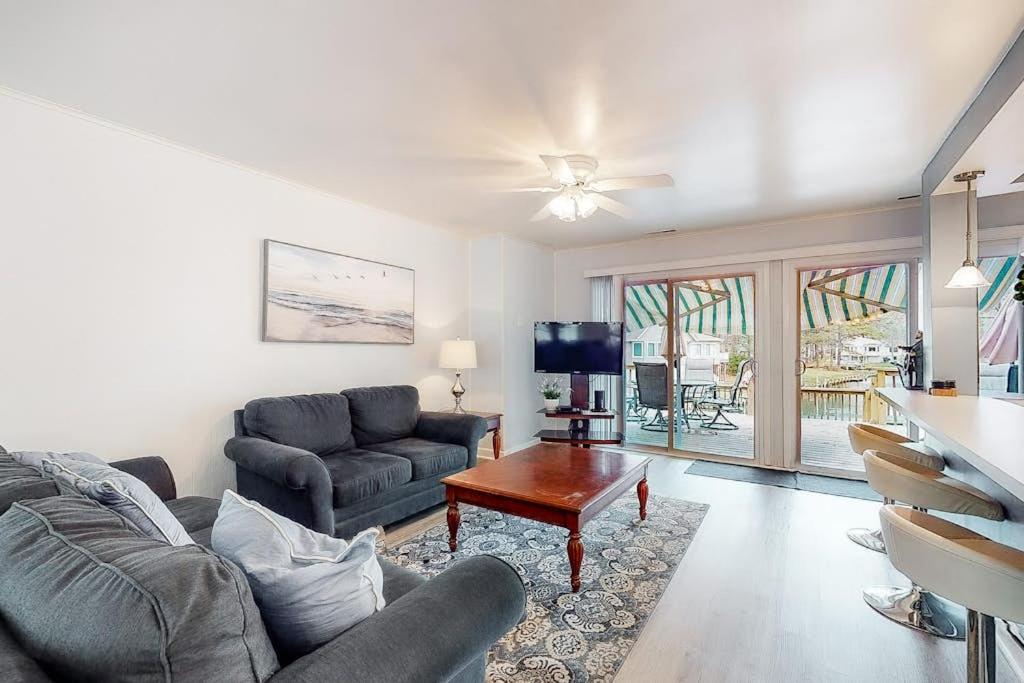 a living room with a couch and a table at Drawbridge Rd 38 in Ocean Pines