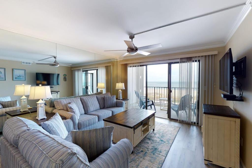 a living room with two couches and a table at Plaza 211 in Ocean City