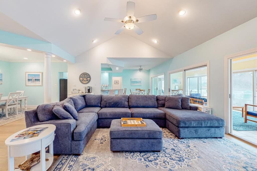 a large living room with a couch and a table at Turtle Shores in Ocean Pines