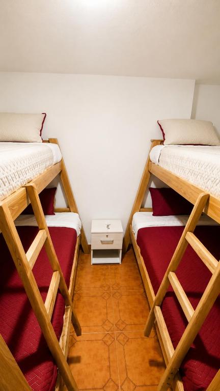 a room with two bunk beds in a room at Morada Living Bello HomeStay in Bello