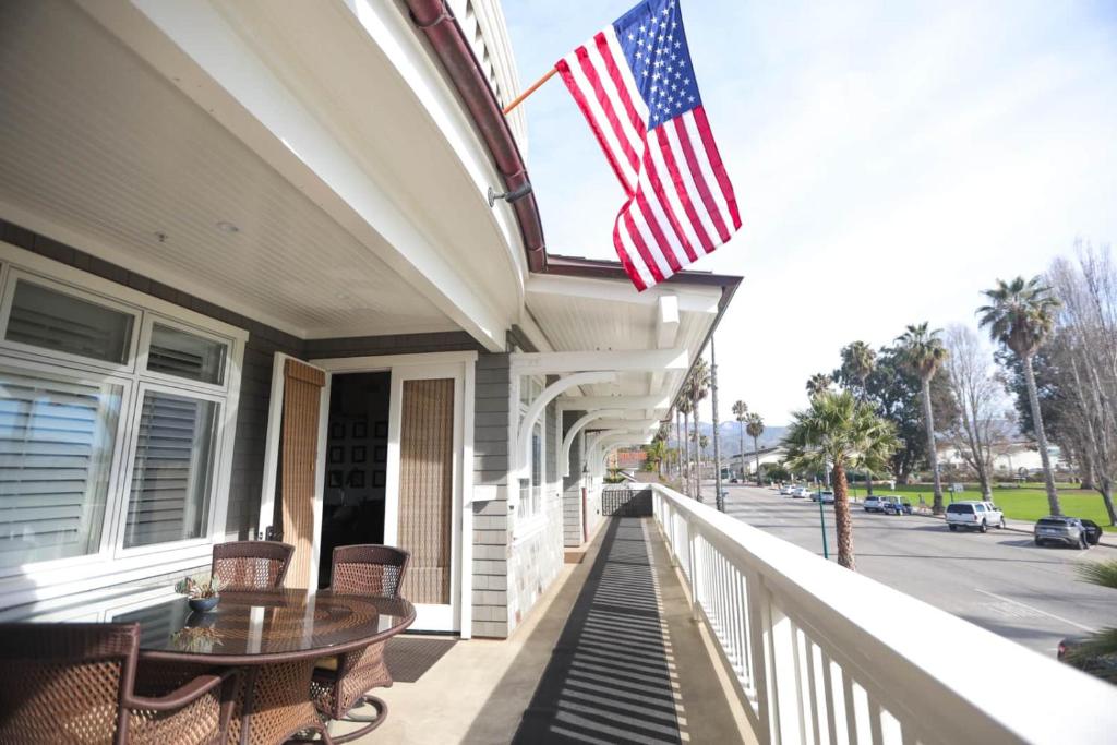an american flag on the porch of a house at Playa Penthouse (Ocean Views) in Carpinteria