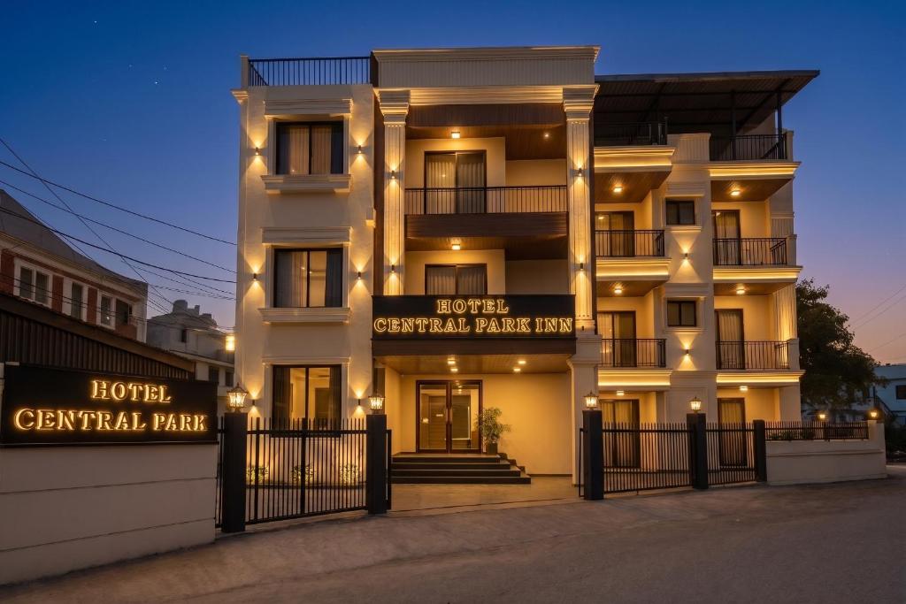 a large white building with lights on it at Hotel Central Park Inn, in Dehradun