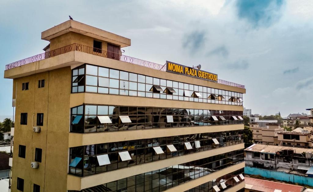 a building with a clock tower on top of it at Moima Plaza Guesthouse in Monrovia