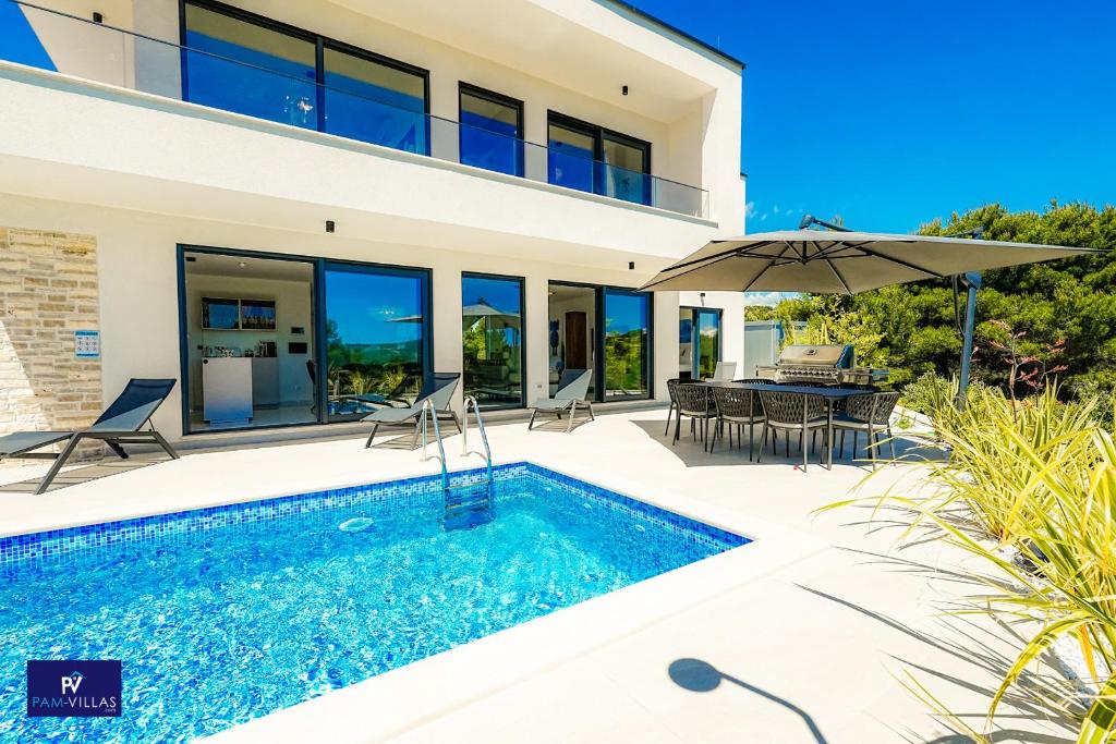 an image of a villa with a swimming pool at Primosten Hills West - Branded Luxury Villa in Primošten