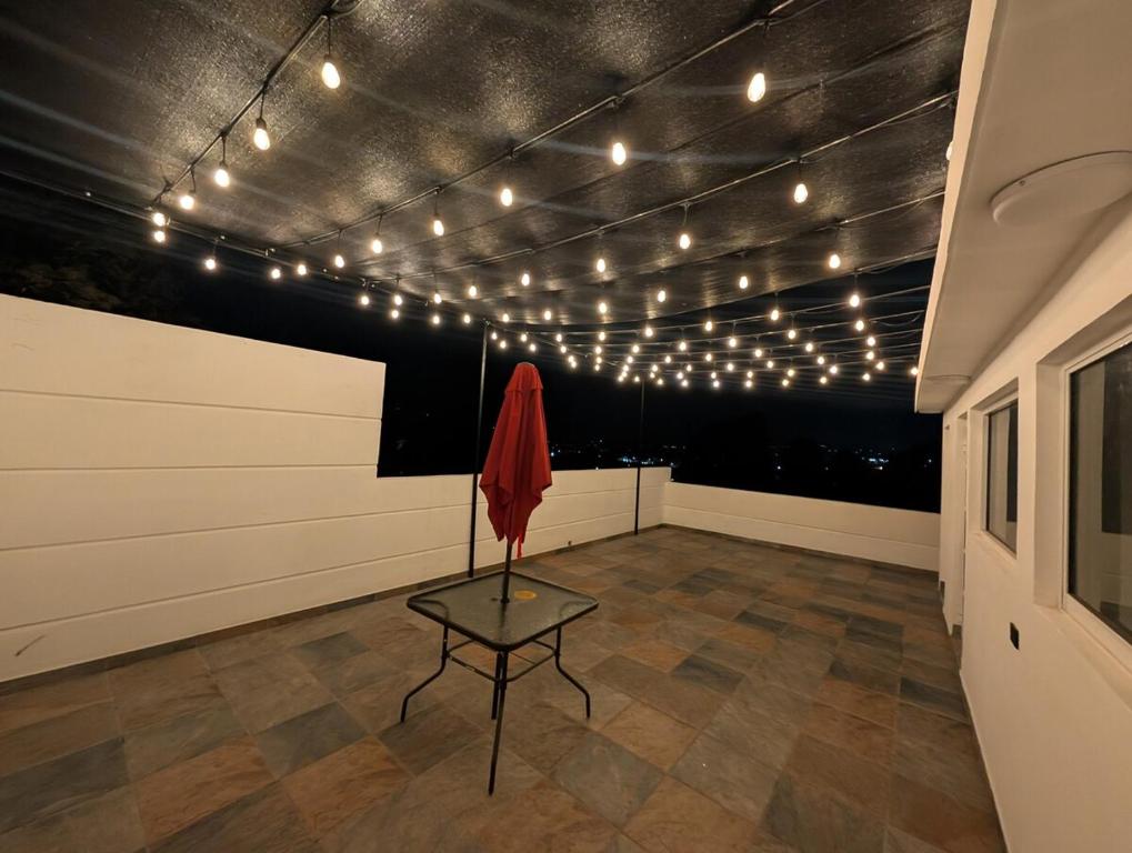 a room with a table and lights on the ceiling at Casa Terraza Zacatlan in Zacatlán